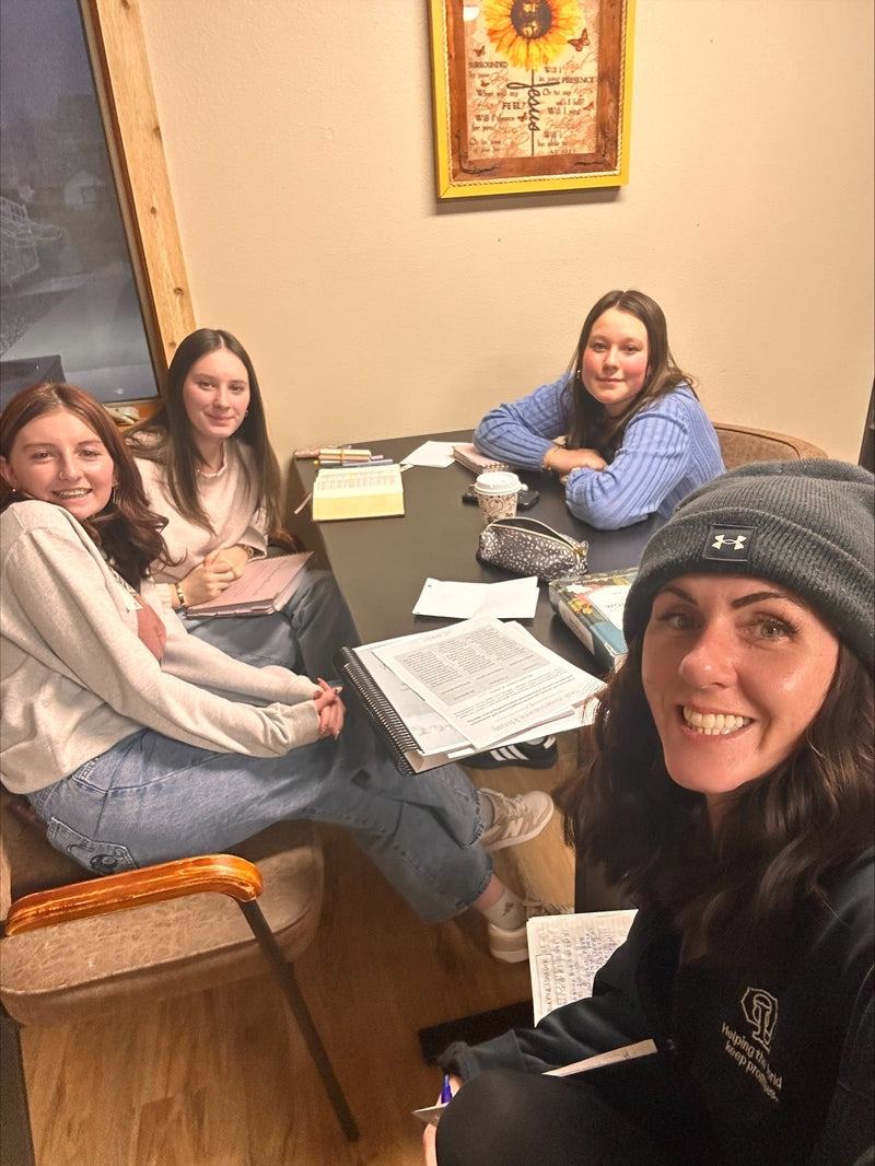 Young woman being mentored in Bible study discipleship relationship
